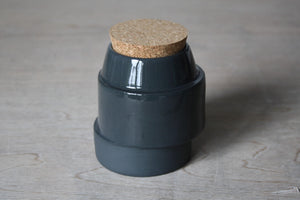 Off-centre Corked Container